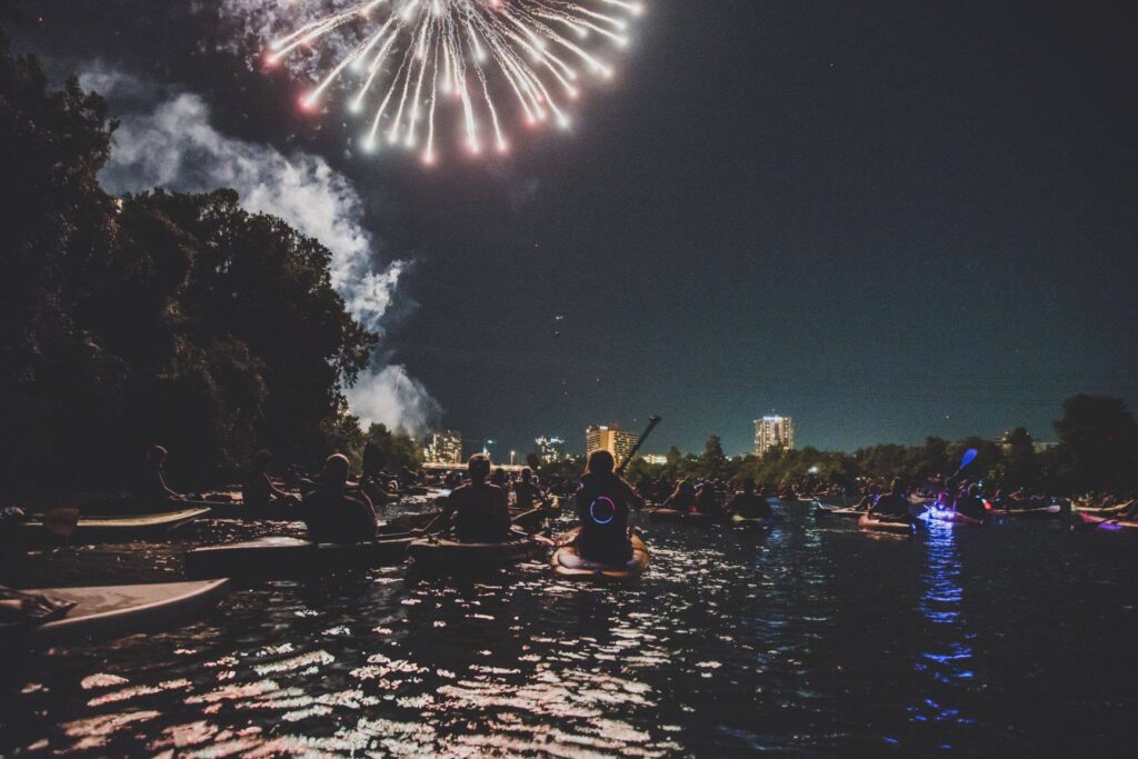 Watch the fireworks on the lake at Rowing Dock. (Photo by Josh Garza)