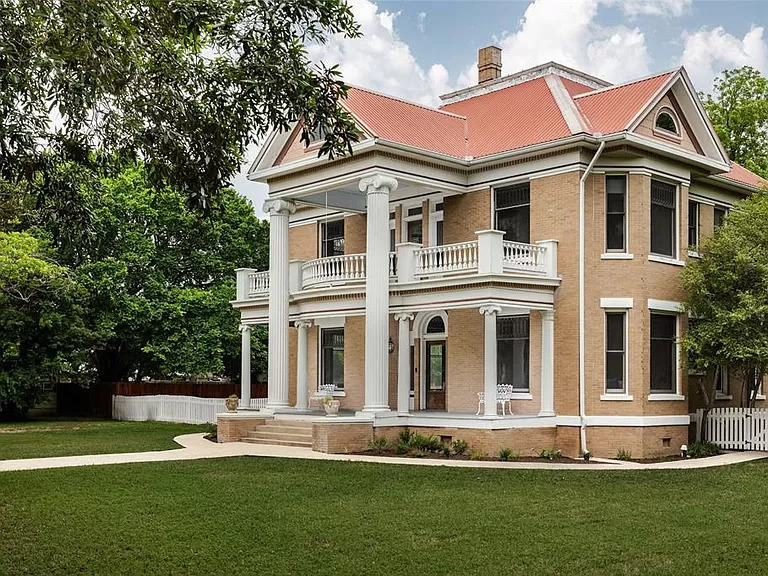 Front yard and entrance of “The Judge’s House,” (photo courtesy of Douglas Elliman Real Estate).