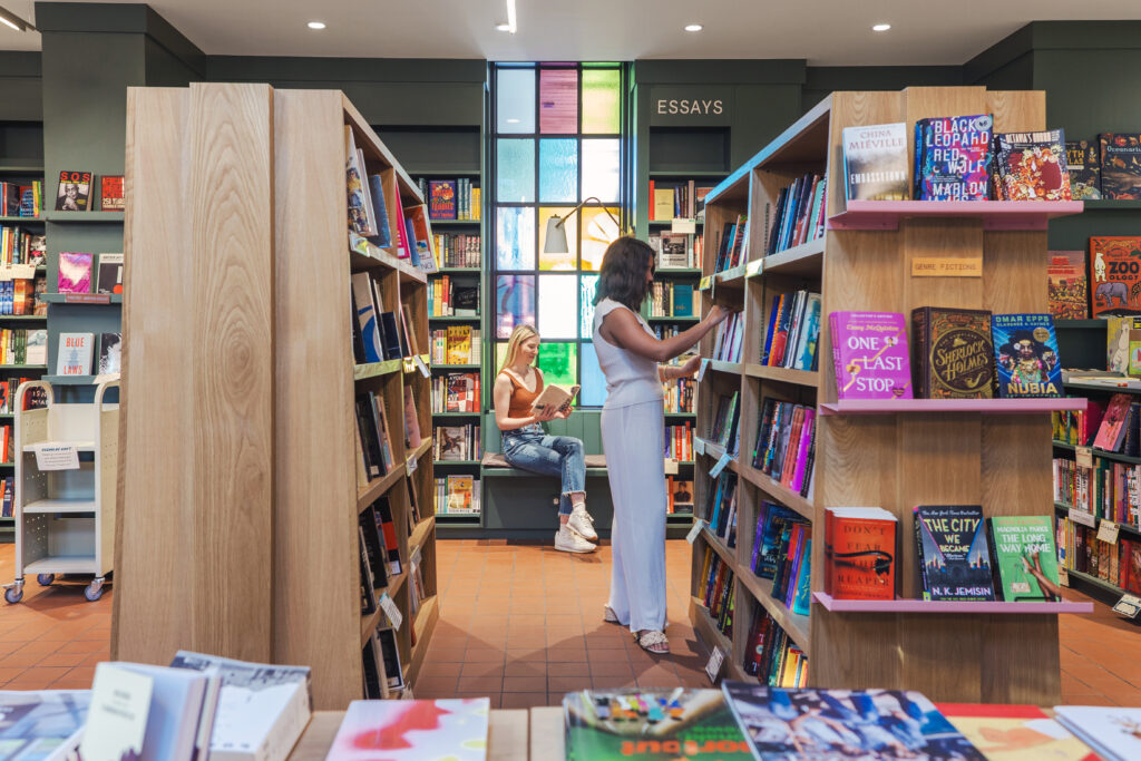 Shppers browsing books at First Light Book Shop in Austin, Texas