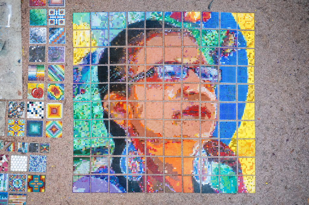 Stepping stone mosaic at Something Cool Studios honors the work and legacy of living legend and community leader Susana Almanza, co-founder and director of PODER Austin (Photo by Tony Moreno)