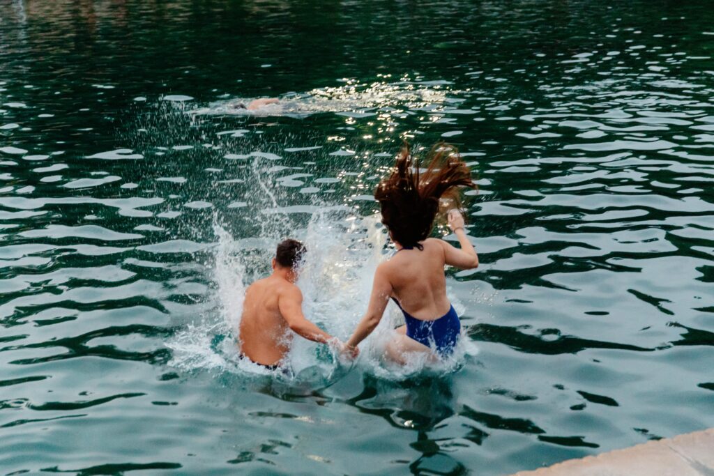 Jumping into Barton Springs at dusk