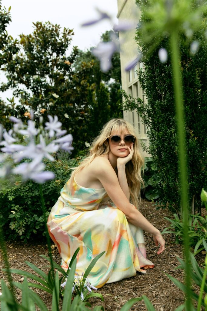 Jenna Jacobs wears Dress by Ginger & Smart ($595) courtesy of Saks Fifth Avenue in the garden at Commodore Perry Estate. (photo by Kaity Cox)
