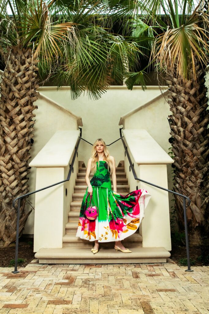 Jenna Jacobs wears Erdem Dress ($4,895); Stuart Weitzman Pumps ($495); Loewe x Paula's Ibiza Woven Bird Bag ($1,250) (photo by Kaity Cox)