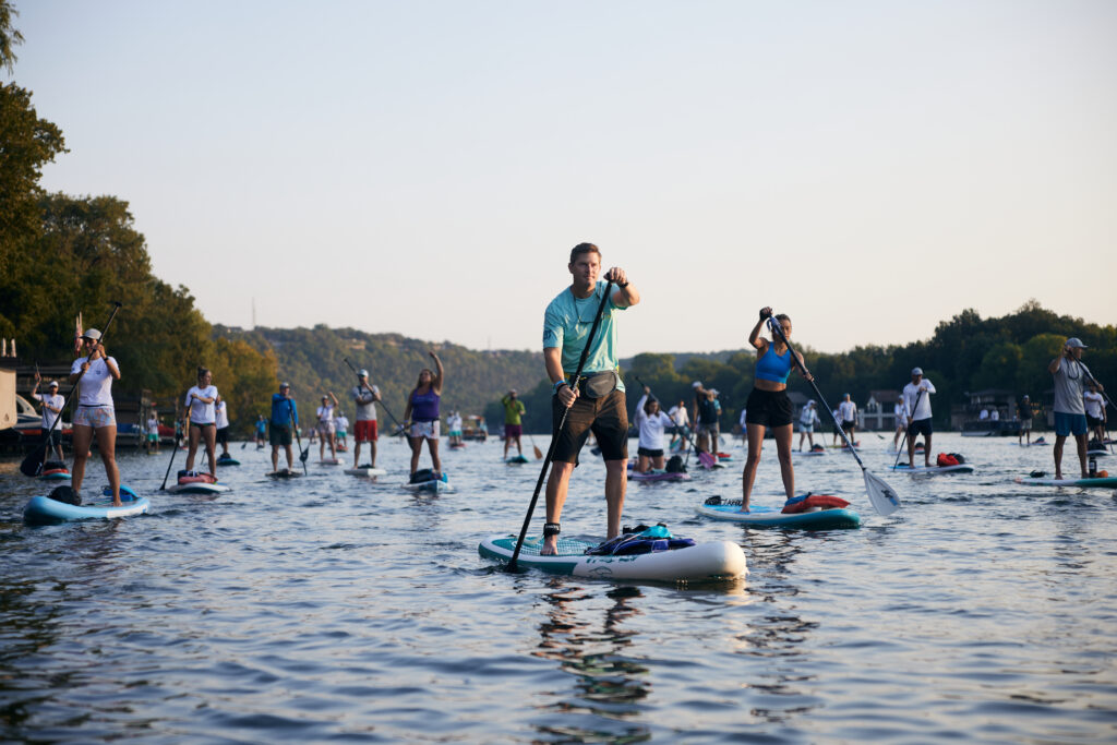 Paddleboarders take to the lake for the Flatwater Foundatin's Damn That Cancer event (photo by Caleb Kerr Photo)