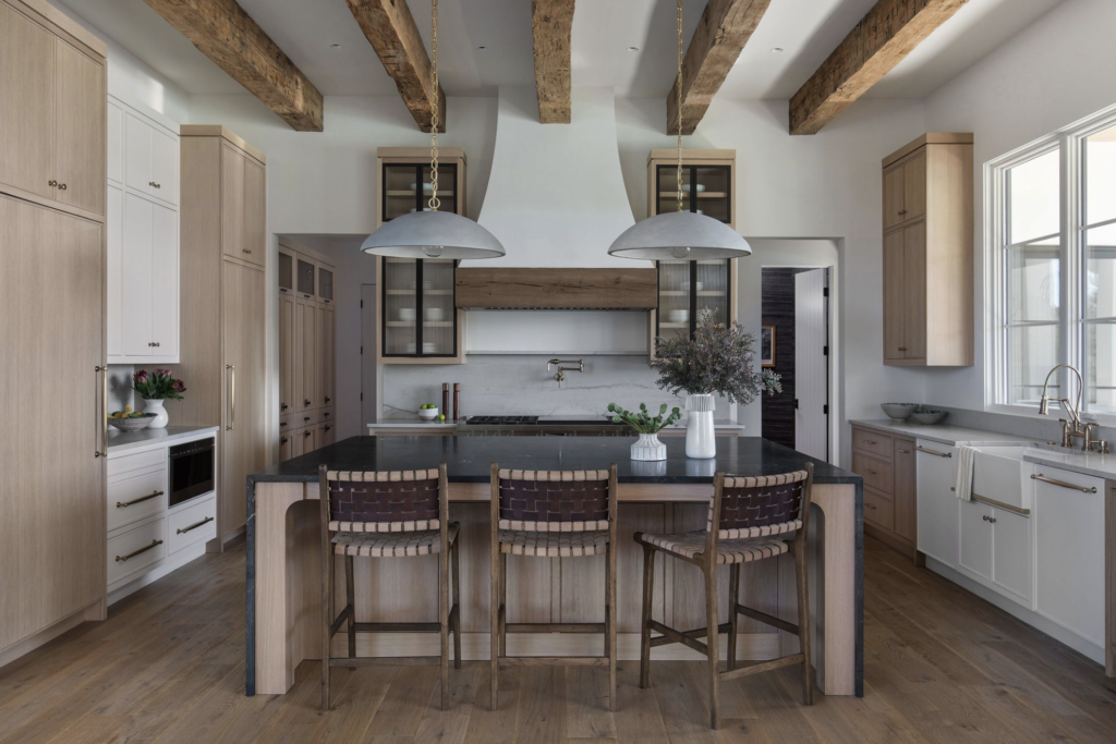 Reclaimed wood beams give warmth to the kitchen.