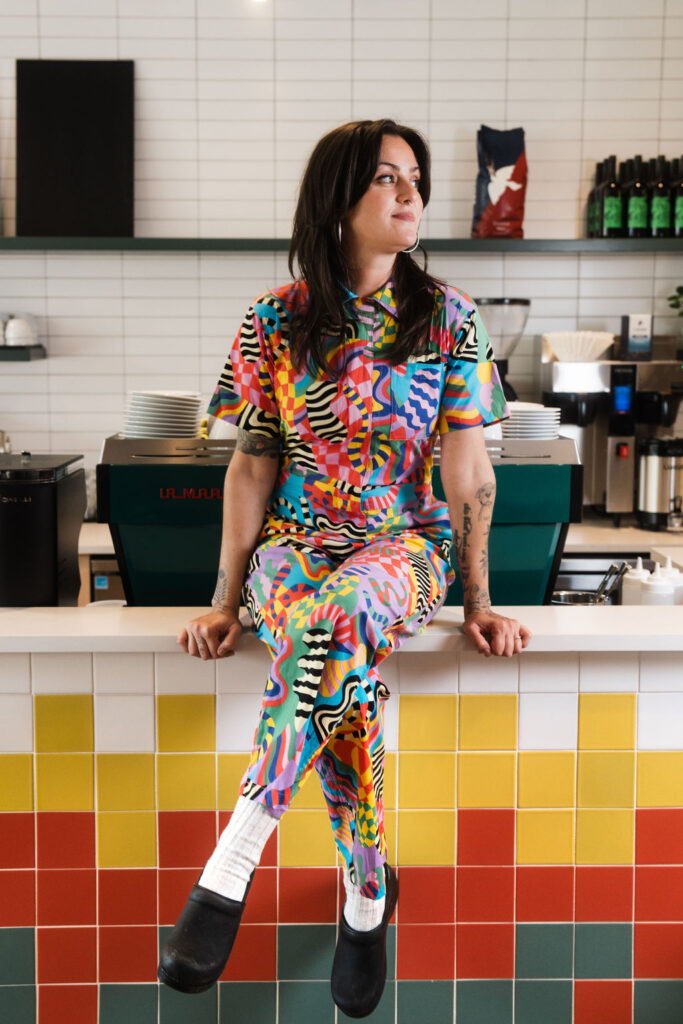Amanda Rockman in the colorful Rockman Coffee + Bakeshop (photo by Roger Ho)