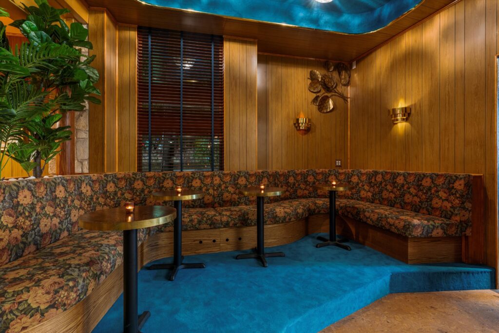 Floral upholstered cocktail lounge area. (Photo courtesy of The Flower Shop)