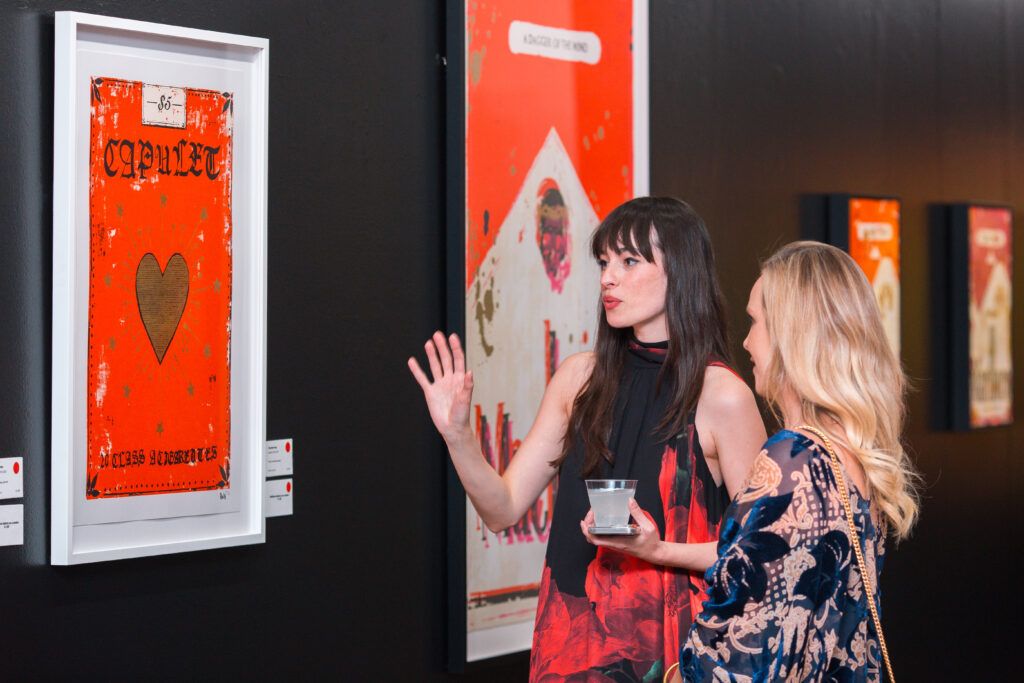 Artist Charlotte Rose discusses her work at the opening reception of the exhibit at West Chelsea Contemporary.