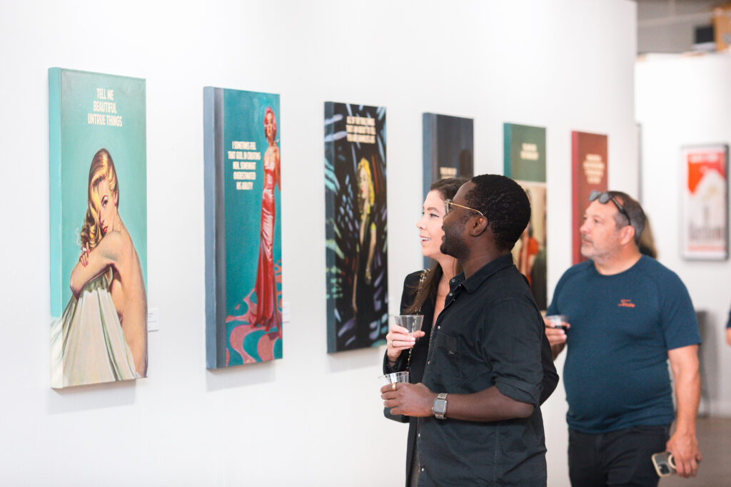 Guests viewing The Connor Brothers' artwork at the opening reception of the exhibit at West Chelsea Contemporary. (Photo courtesy of WCC)