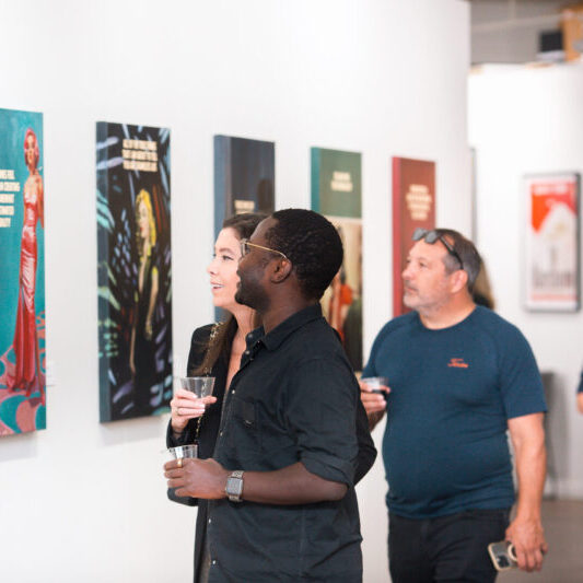 Guests viewing The Connor Brothers' artwork at the opening reception of the exhibit at West Chelsea Contemporary. (Photo courtesy of WCC)