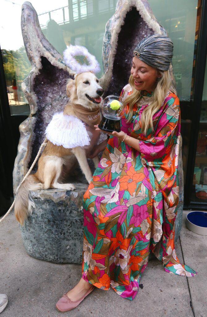 Sarah K. Wolf shows off her "crystal" tennis ball during a dog tarot reading.