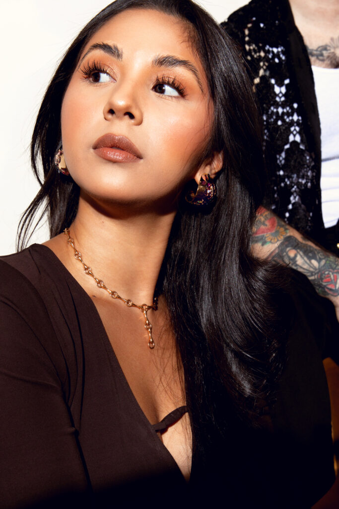 On Gabby: Dress by FRAME; necklace and earrings by Nak Armstrong