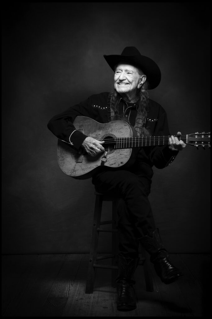 Willie Nelson, country music legend, playong guitar
