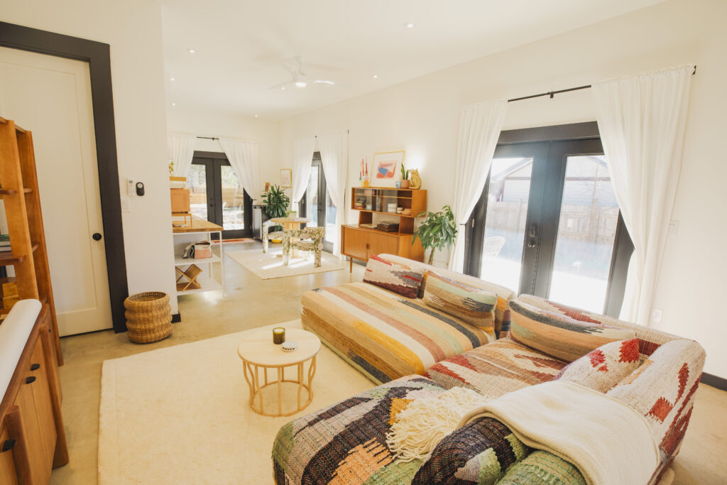 Living room and kitchenette space at Little Lockhart Oasis.