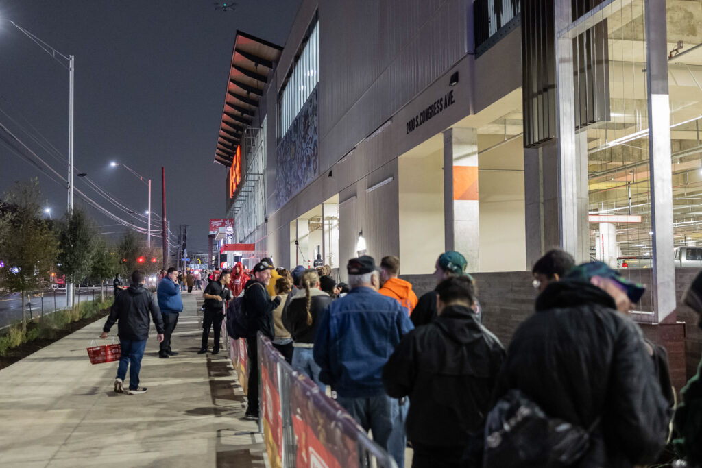 Shoppers line up outside the newly rebuilt South Congress H-E-B in Austin, Texas, before its grand opening at 6 a.m. on Wednesday, Dec. 4, 2024.