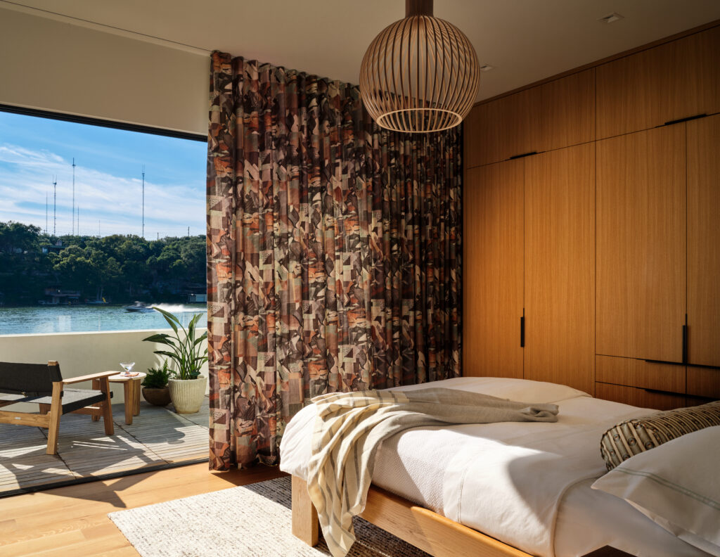 Water’s Edge Primary bedroom ( photo by_ Clay Grier)