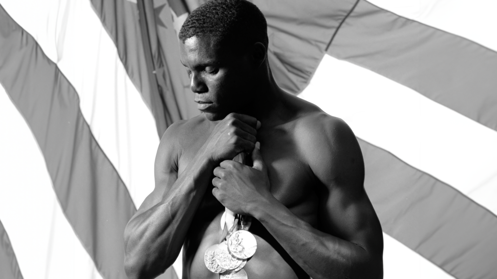 Carl Lewis with Medals. (Photo by Getty Images/Joe McNally)