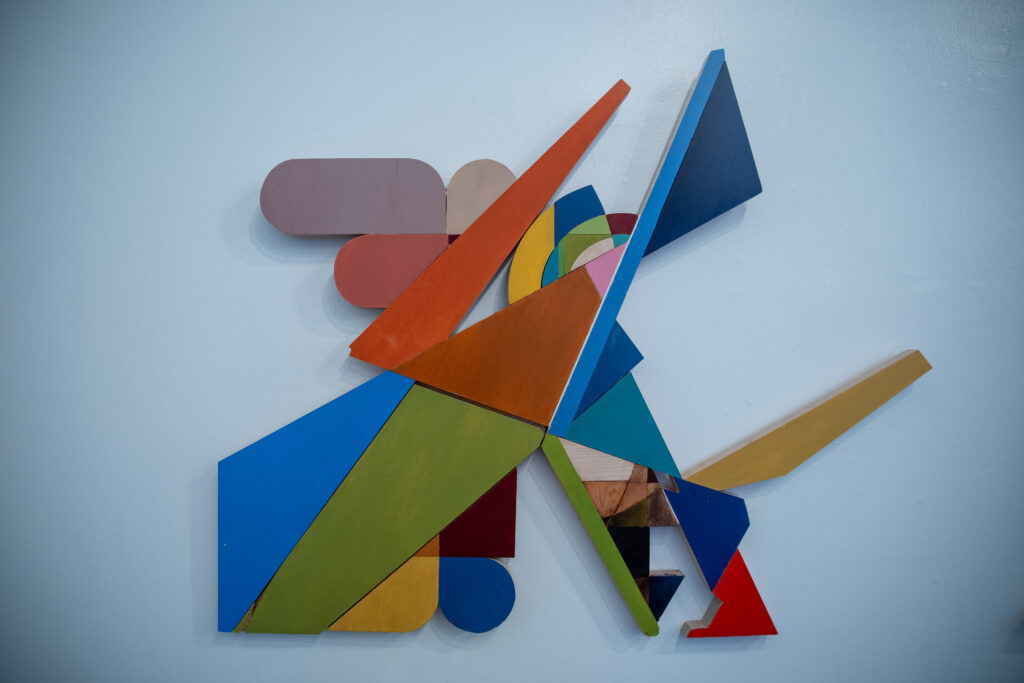 "Impossible Archways," a colorful, geometric work by Felipe Gomez made with acrylic on white maple, is currently on view at The People’s Gallery at Austin City Hall.