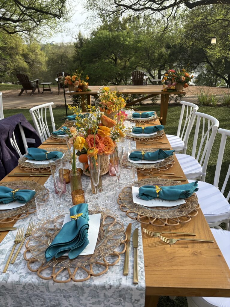 A floral spring table setting is prepared for the Viva Abejas dinner at the Four Seasons Hotel in Austin. (Photo by Christina Garcia)