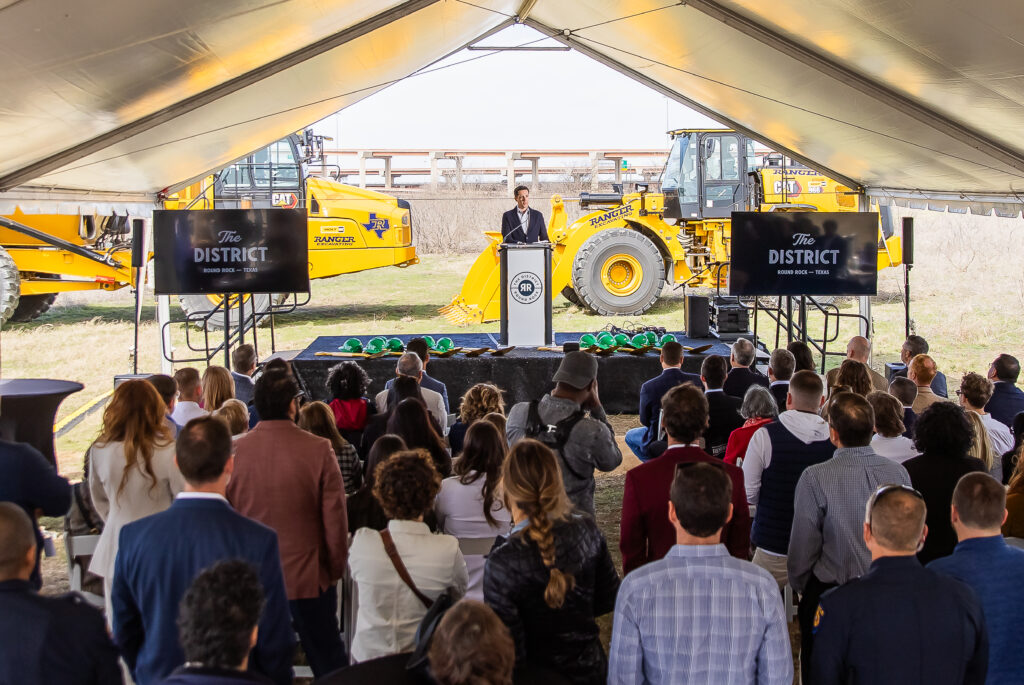 Justin Basie, President of Real Estate at Mark IV Capital, speaks at The District groundbreaking event in Round Rock. (Photo courtesy of Mark IV Capital.)