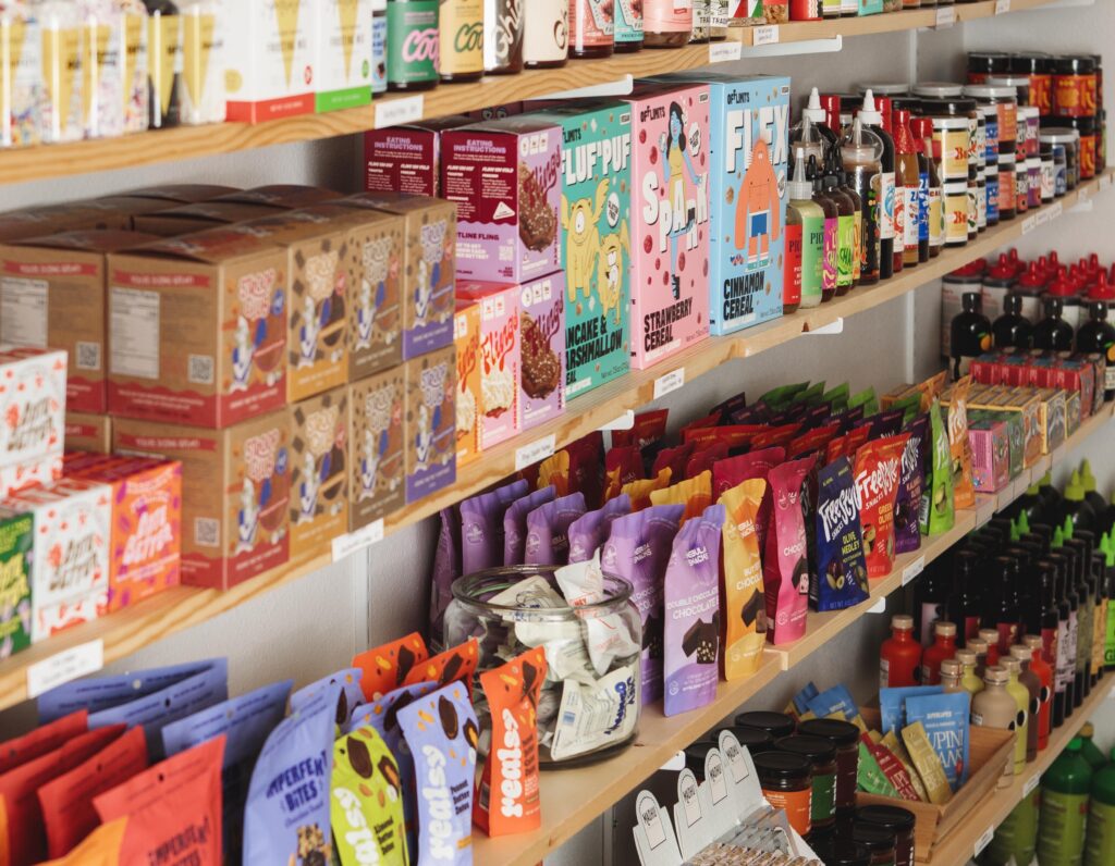 Shelves stocked with snacks, oils, seasonings and more are seen at Parker + Scott. (Photo courtesy of Parker + Scott)