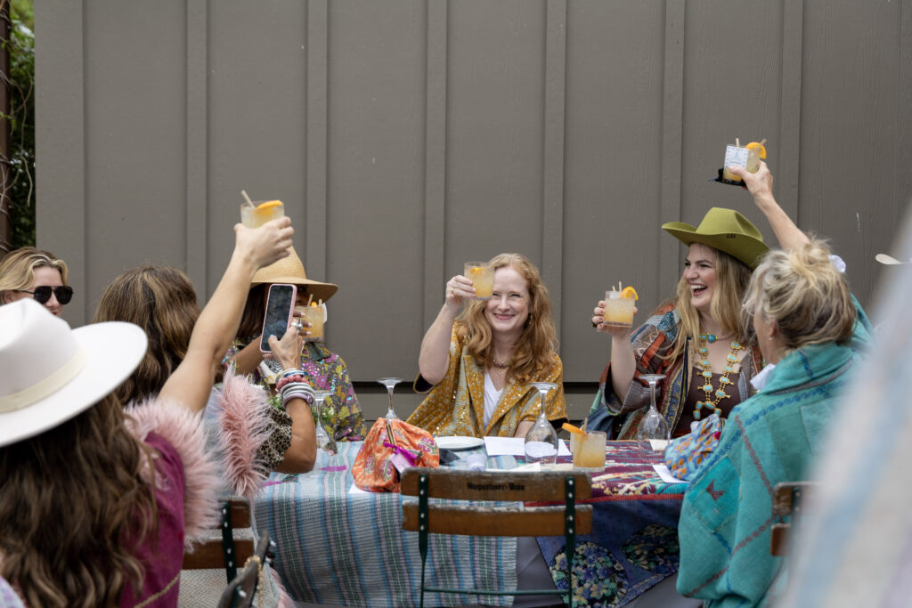 Sapana Founder, Jolie Helms, toasts to guests with Socorro Tequila cocktails at Lulu’s Round Top