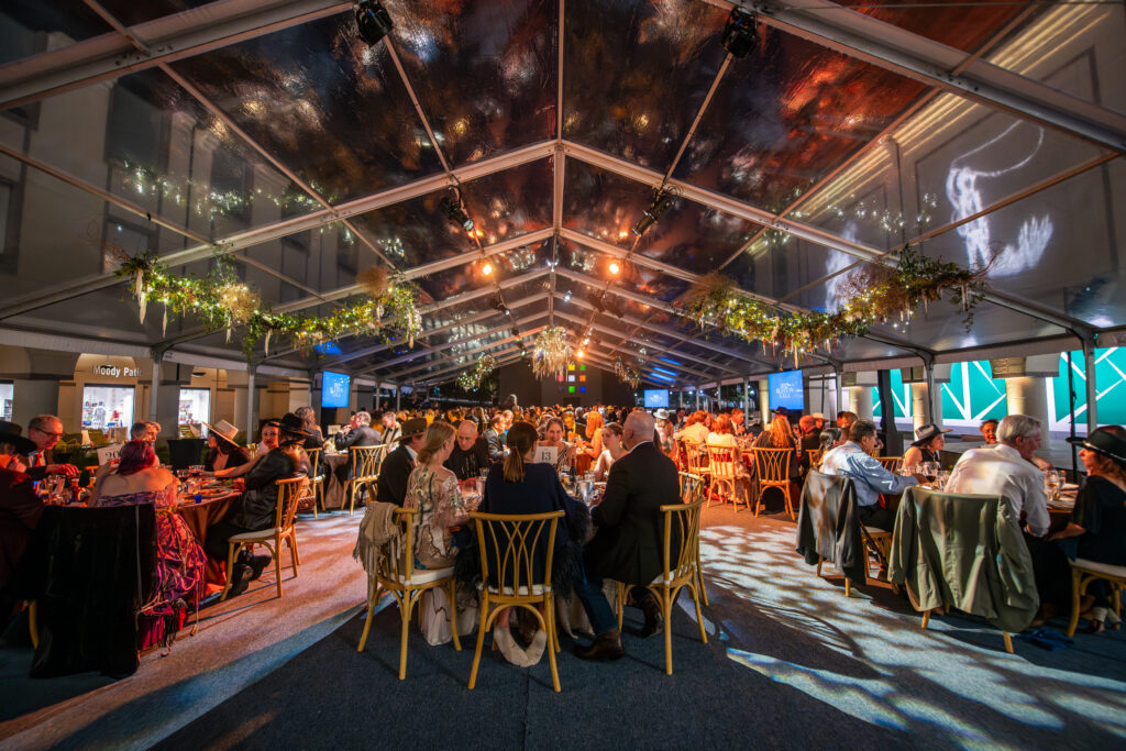 Gala attendees dine at the Blanton Museum of Art with barbecue from newly Michelin-starred LeRoy and Lewis, paired with wines curated by Twin Liquors and Shiner Beer. (Photo by David Brendan Hall)