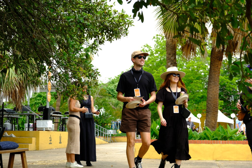 Guests walk through the Field Guide Festival grounds at Fiesta Gardens in Austin, Texas, on Sunday, April 27, 2025. (Photo by Amelia Engstrom)