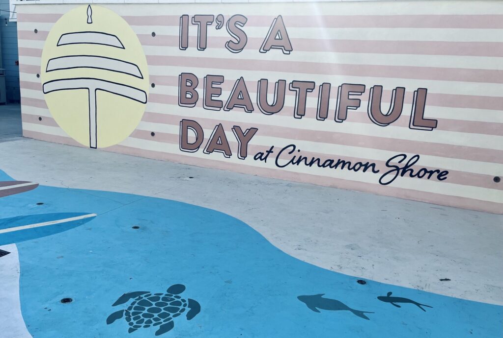 mural at cinnamon shore that says "It's a beautiful day"