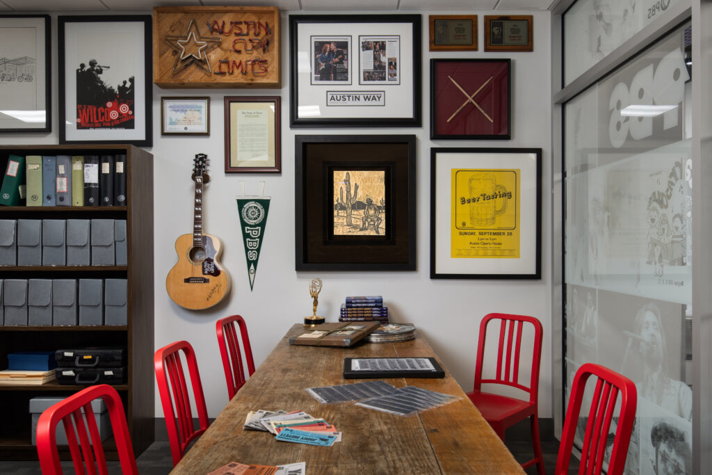 The space includes custom shelving and workstations for archival staff and visitors.
