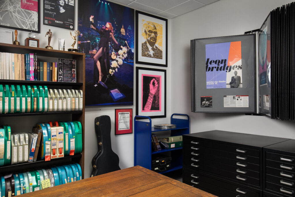The archive room at Austin PBS’s new headquarters showcases decades of broadcast history with framed images from Austin City Limits and the station’s early years