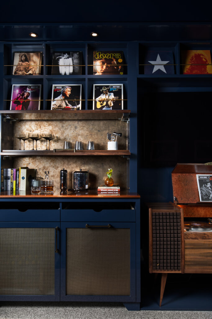 The Green Room at Austin PBS, redesigned by Britt Design Group, features lounge seating, a custom record console, and guitars on display in tribute to Austin’s music culture.