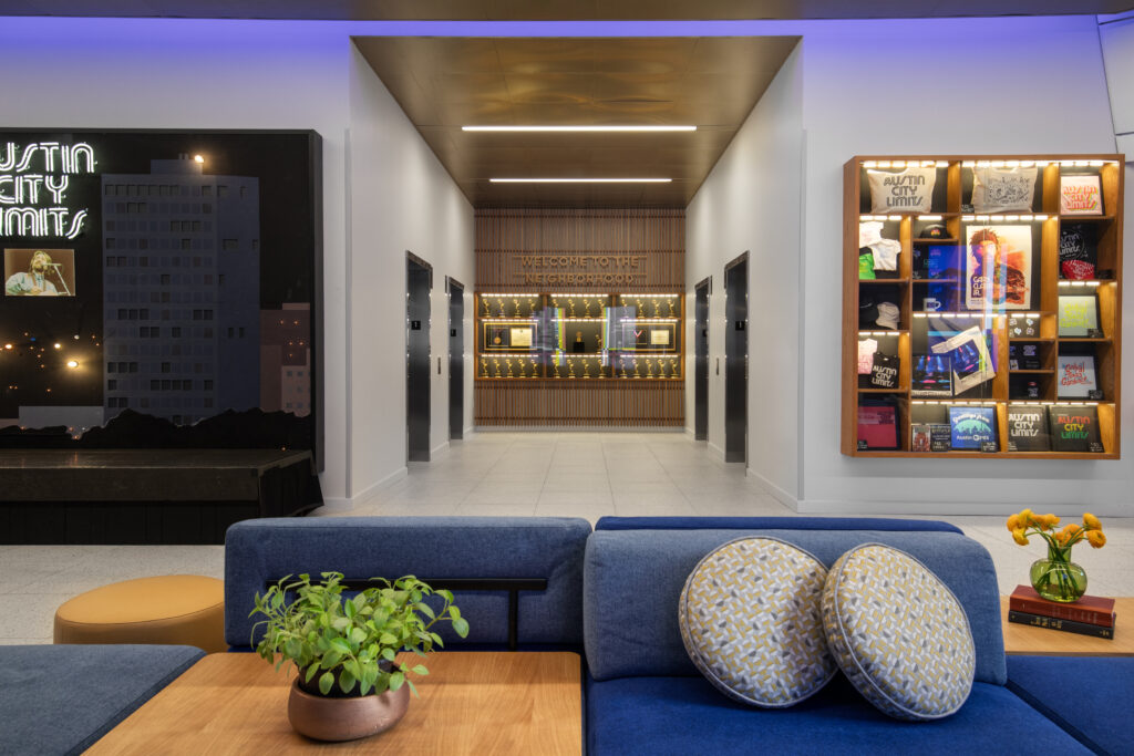 The lobby of the newly redesigned Austin PBS headquarters features natural light, modular furniture for public events, and a custom sign by local design firm Asterisk