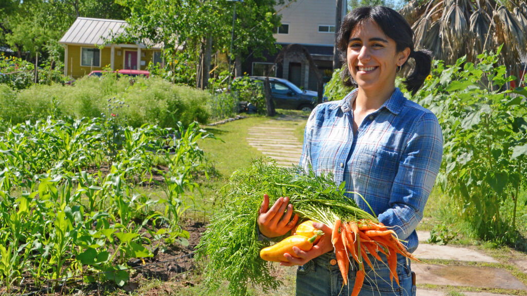 Anamaria Gutierrez, garden manager at Este in East Austin, stands among the seasonal crops she helps grow for the restaurant’s menu. (Courtesy of Central Texas Gardener)