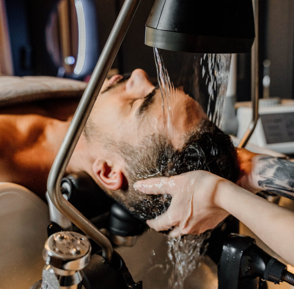 Man gets a scalp treatment.