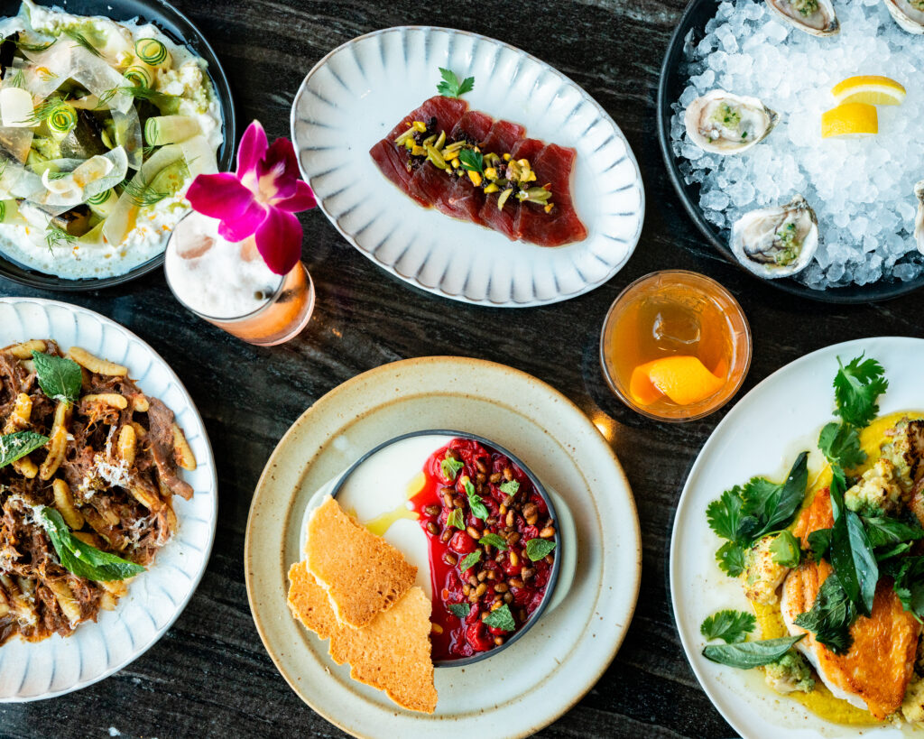 Spread of cocktails and food on the summer menu at Nido at Loren Hotel Austin. (Photo by Dani Parsons)
