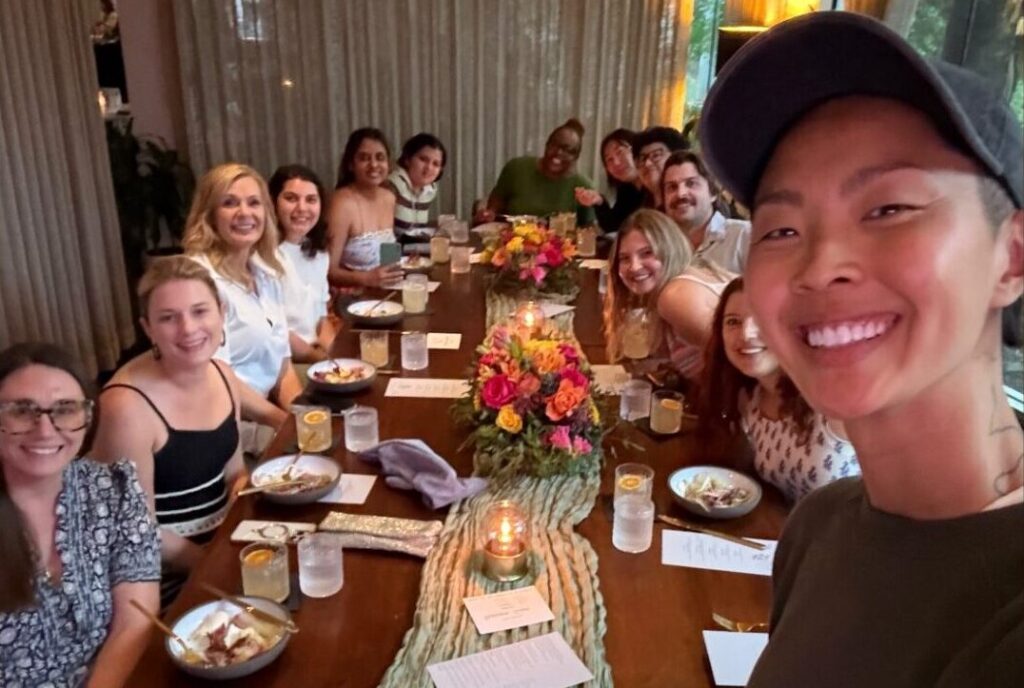 Chef Kristen Kish takes a selfie with guests during A Seat at the Screen, a weekly dinner series at Arlo Grey in Austin