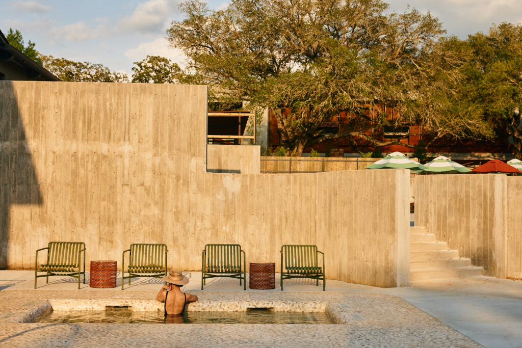 woman taking a soak in Ottine Mineral Springs