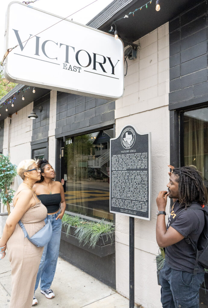 Tour participants gather outside Victory East, formerly Victory Grill, a historic venue on the Chitlin Circuit that hosted legendary musicians since 1945. (Photo by Cassie Butterfield)