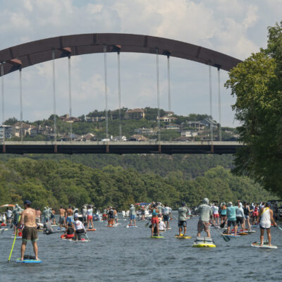 Paddle boarders at Flatwater’s Dam That Cancer event. (Photo by Roland Jimenez)
