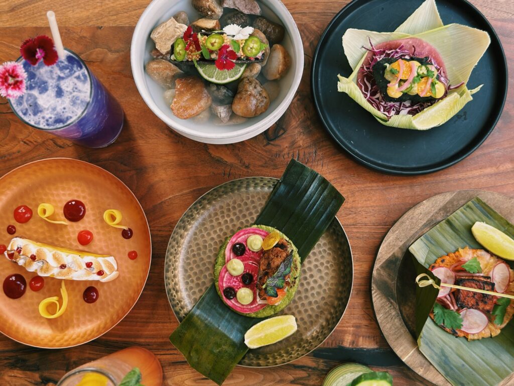NOMADÉ Cocina Austin -spread of various dishes
