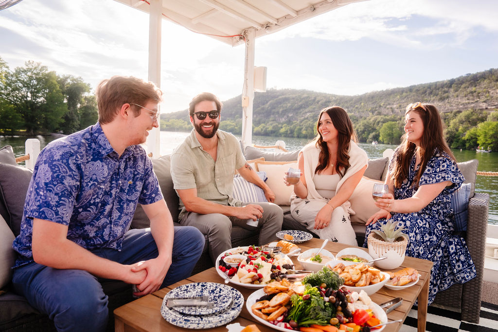 group having happy hour on a houseboat on Lake Austin.