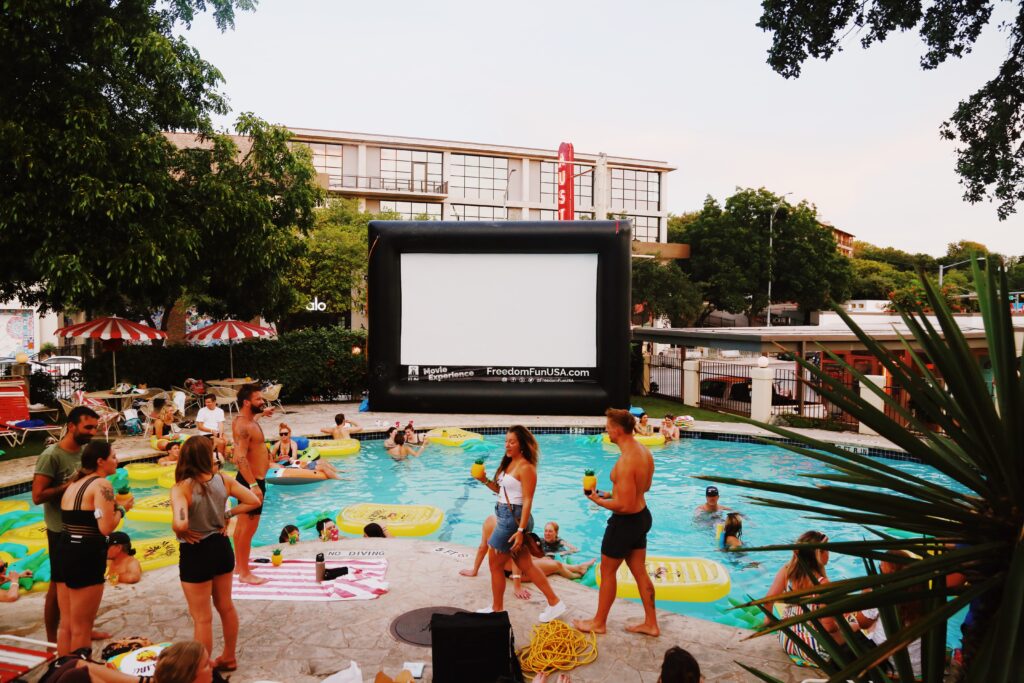 Moviegoers gather for a screening during the Float Films series at the Austin Motel pool on South Congress Avenue.