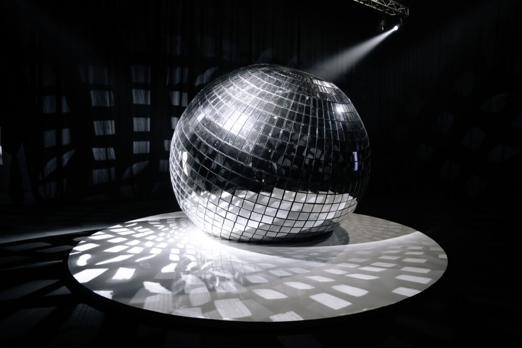 “Her Joy” by Alex Schweder features a mirrored, breathing sphere that reflects light and movement, inviting viewers into a meditative experience.