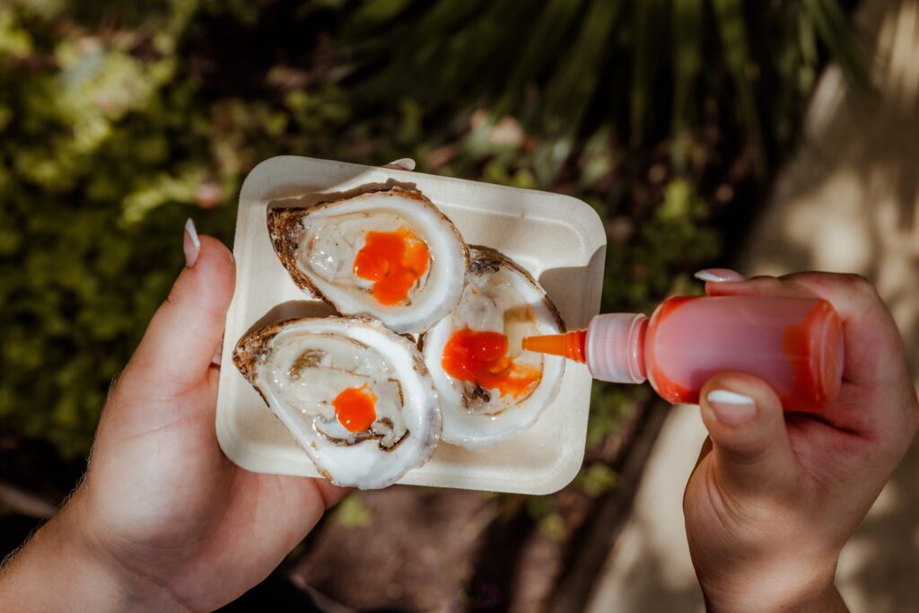 Pink Moon oysters with lime jelly and fermented red jalapeño. (Photo by Grant Pifer)