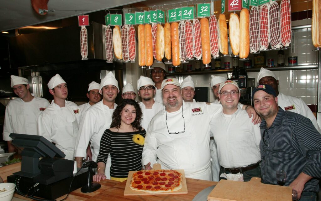 Damien Mandola, founder of Mandola’s Italian Kitchen, is pictured with team members.