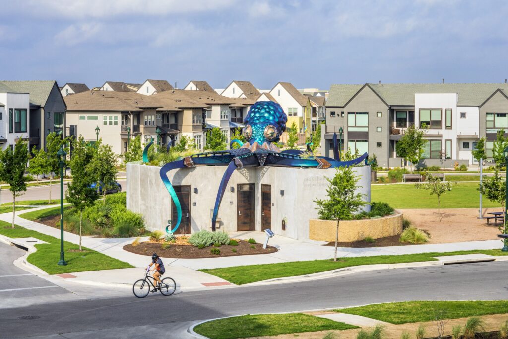 Jessie Andrews Park, a one-acre greenspace in Mueller, features an art installation of a 20-foot octopus named Ocho. (Photo by Thomas McConnell)