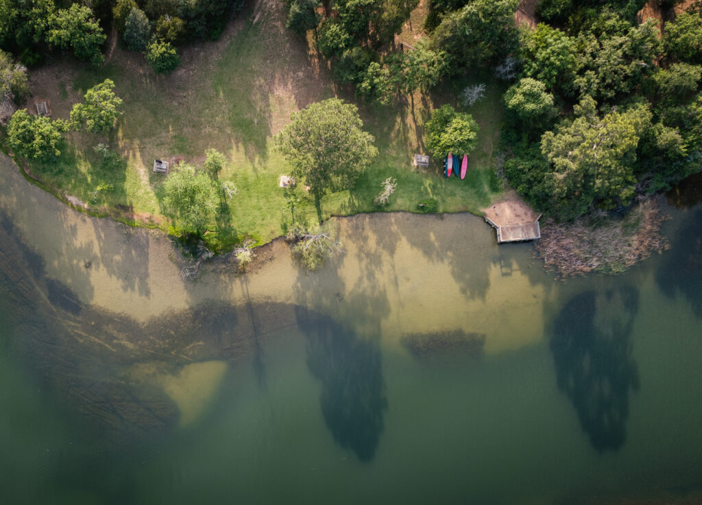 An aerial view of Lake Bastrop, located nearby the mirror cabins at South Shore Park.