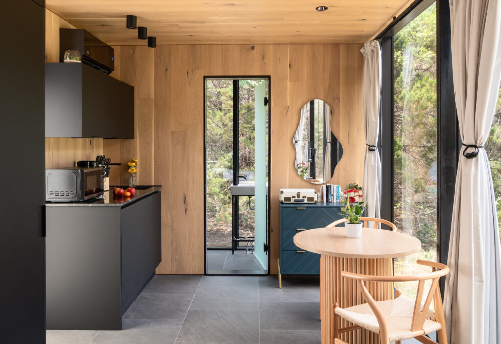 The Bloom cabin at Lake Bastrop South Shore Park includes a dining area and kitchenette.