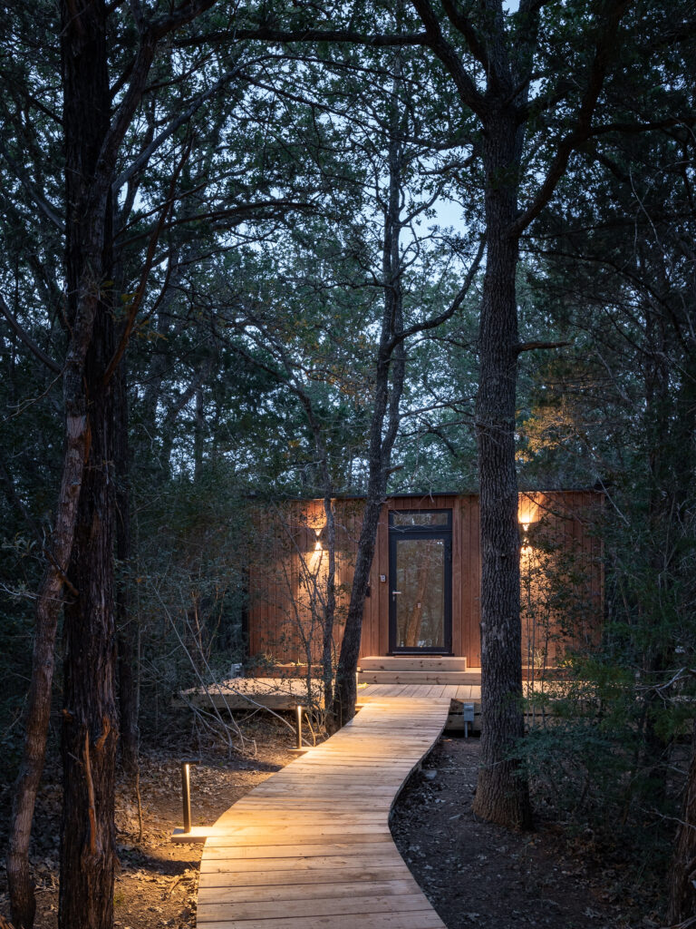 The front entrance of The Hideaway cabin at dusk.